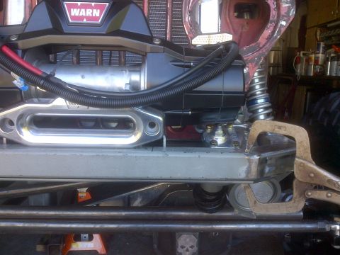 1985 Jeep CJ7 - Custom fabrication work on a Jeep's front end, focusing on the winch and bumper assembly.