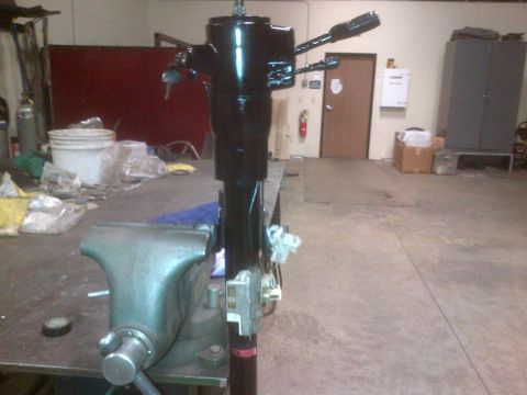 1985 Jeep CJ7 - Steering column assembly secured in a vise on a workbench in a garage setting.