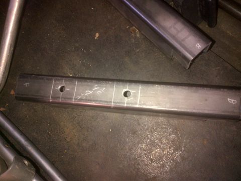 1985 Jeep CJ7 - Metal tubing is marked and drilled for a project.