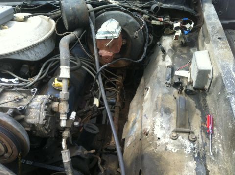 1979 Ford Bronco - Close-up view of a vehicle's engine bay, focusing on the brake system components and wiring.