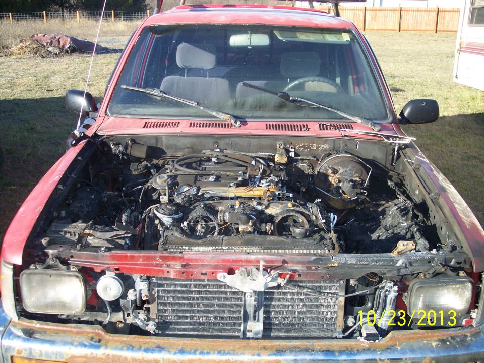 1991 Toyota Pickup/SR5 front view with damaged engine