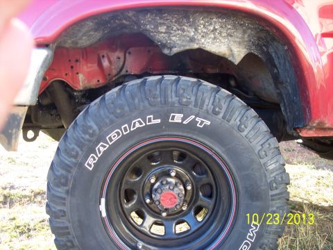 1991 Toyota Pickup/SR5 - Close-up of a vehicle's wheel well and tire, with a date stamp visible.