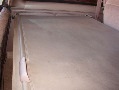 1983 Ford Bronco - Factory Bronco cargo cover fully extended. Factory cargo net missing. Aftermarket cargo tray visible.