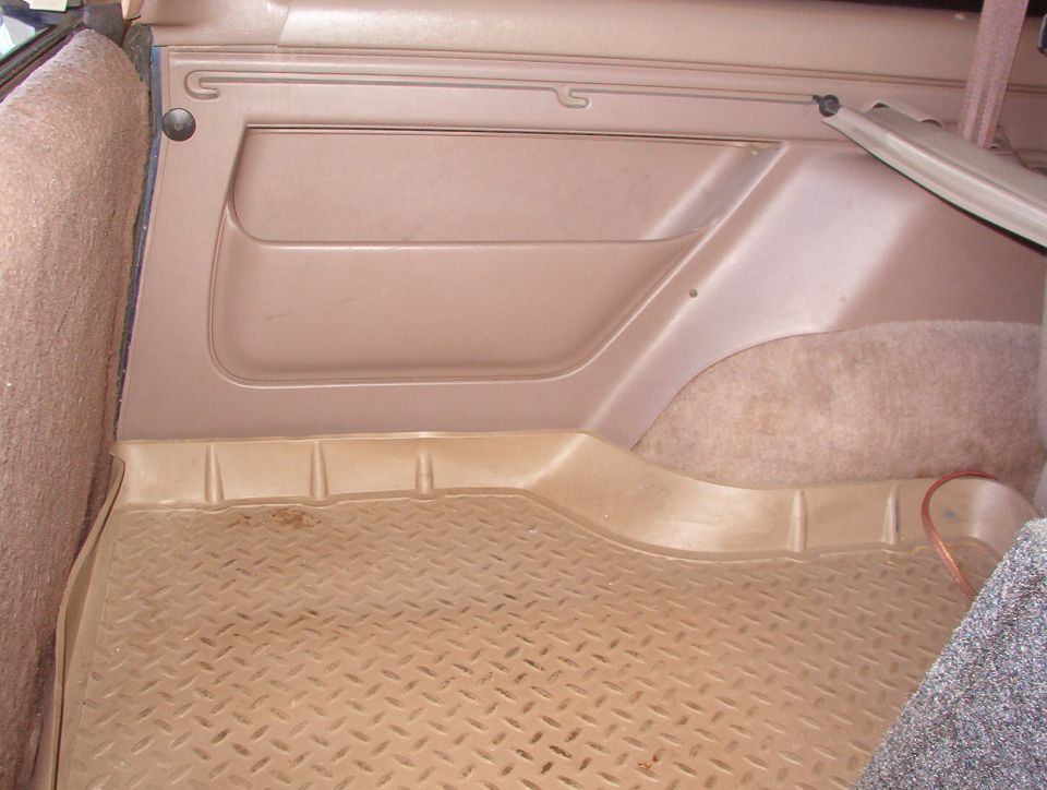 Fully retracted.  Cargo tray is aftermarket, and factory cargo net is missing.