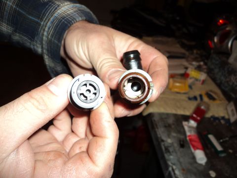 2004 Mercury Grand Marquis - Comparison of a new fuel line quick disconnect fitting with an older, used one.
