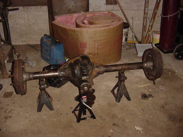 Ford Bronco rear axle assembly on jack stands, with "60-2" cast into the differential housing