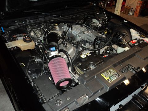 2004 Mercury Grand Marquis - Engine bay modifications are visible, including a supercharger and aftermarket air intake.