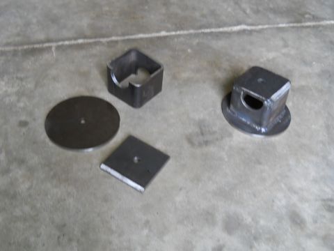 1992 Ford Bronco - Various metal components are laid out on a concrete surface, with a watermark indicating 'SUPERMOTORS.NET'.