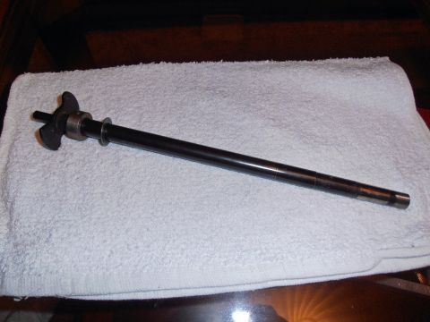 1990 Ford Bronco - Distributor shaft with rotor and bearing shown on a white towel.