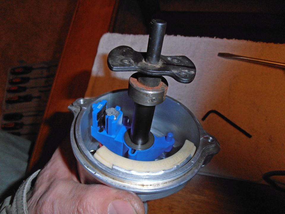 Distributor part with blue plastic components and a metal shaft