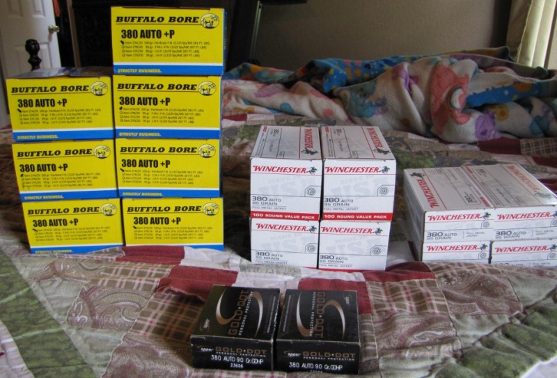 Stack of yellow Buffalo Bore 380 Auto+P ammunition boxes and white Winchester 380 Auto 100 round value packs