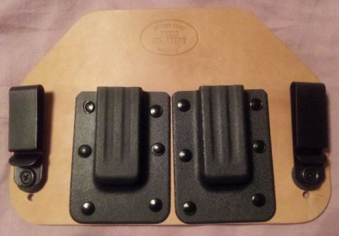 1992 Ford Bronco - This leather holster features two black clips and an embossed logo from Theis Holsters.