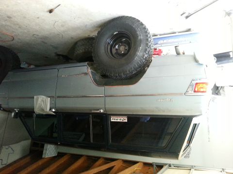 1982 Jeep Wagoneer - This Jeep Wagoneer is shown from the side, with a spare tire mounted externally on the rear.