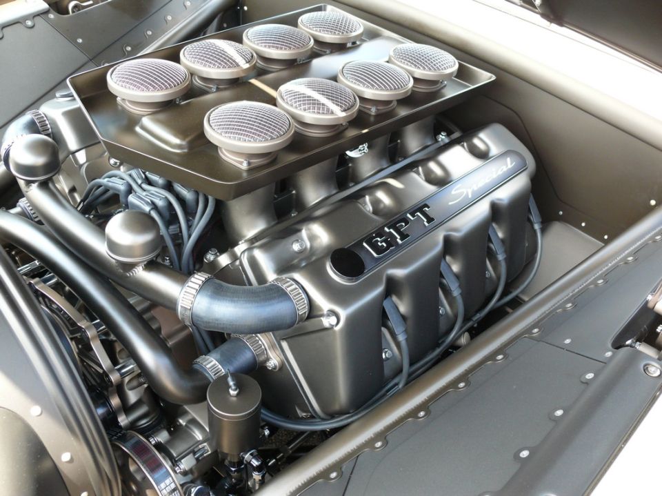 Custom V8 engine with eight air intakes and "GPT Special" on valve cover.