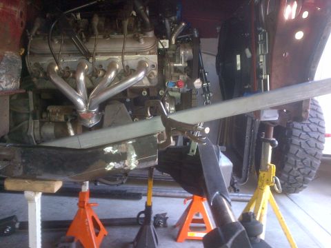 1985 Jeep CJ7 - Close-up view of the undercarriage of a Jeep, showing suspension and chassis elements.