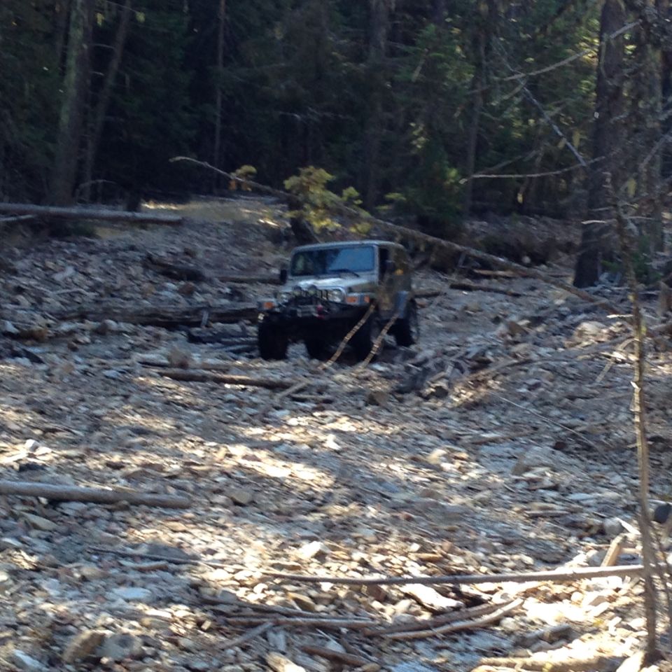 Silver 2005 Jeep Wrangler on rocky trail