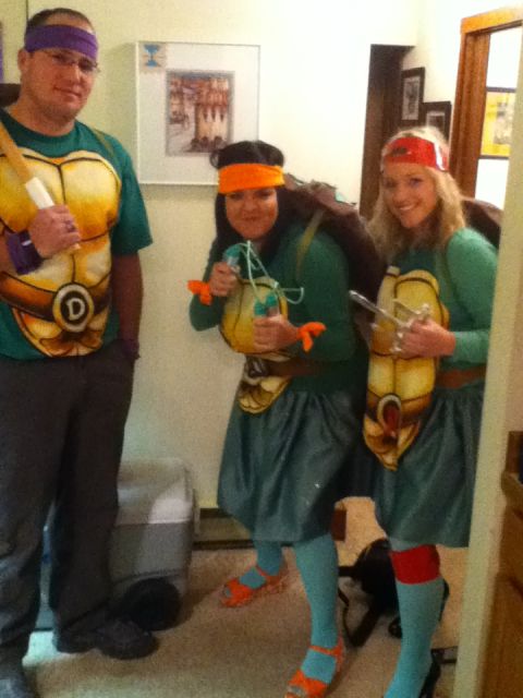 2006 Ford E350 - Three friends pose in Teenage Mutant Ninja Turtle costumes, ready for Halloween fun.