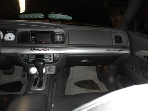 2004 Mercury Grand Marquis - The interior dashboard shows 'Marauder' and 'Supercharged' badging, indicating a modified vehicle.