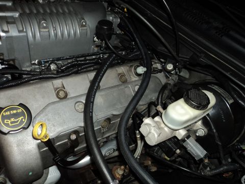 2004 Mercury Grand Marquis - Close-up of an engine bay a supercharger and associated components.