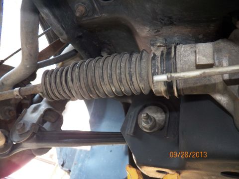 1998 Lincoln Mark VIII - Steering rack bellows and tie rod assembly detail.
