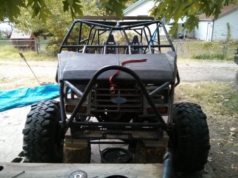 1986 Ford Bronco - Custom buggy with a Ford grille and roll cage, modified for off-road use.