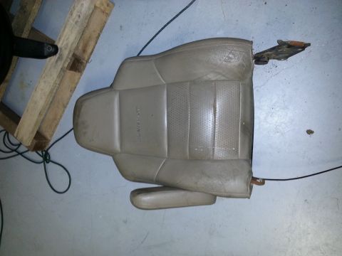 1994 Ford Bronco - Car seat removed from a vehicle, possibly for repair or replacement.