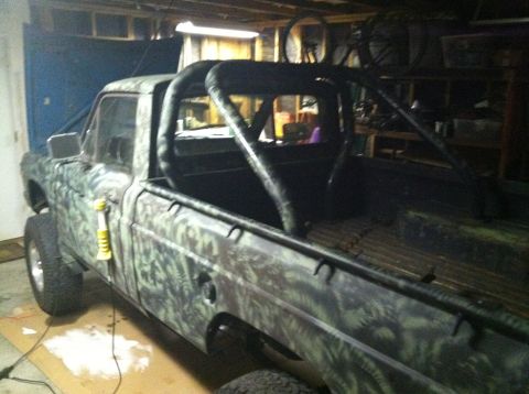 1975 Ford Courier - This pickup truck has a custom roll cage and camouflage paint job.