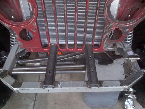 1985 Jeep CJ7 - Close-up view of the chassis and grille structure of a Jeep CJ-series vehicle.