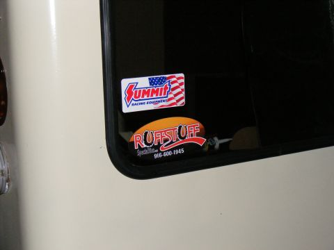 Vehicle window with Summit Racing Equipment and Ruffstuff Specialties stickers. Phone number 916-600-1945 visi