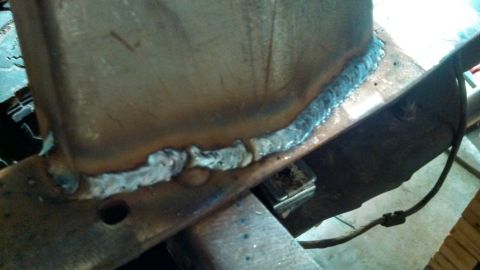 1967 Ford F-250 - A close-up view of a metal frame section showing a freshly applied weld bead.