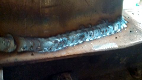 1967 Ford F-250 - A metal part shows a freshly applied weld seam with visible slag and texture.