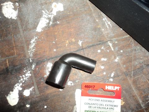 2004 Mercury Grand Marquis - A black rubber PCV end assembly part is shown with its packaging, which includes the part number 46017.