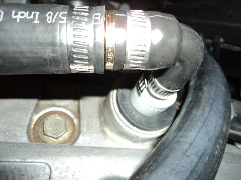 2004 Mercury Grand Marquis - A close-up view of engine hoses and clamps, with visible text indicating the hose size as 5/8 Inch.