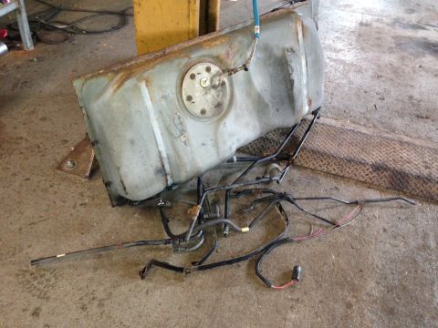 2004 Ford Crown Victoria - This image shows a removed fuel tank and associated lines, likely from a Ford Crown Victoria, as indicated by the registry information.