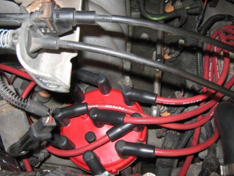 1996 Ford Bronco - Engine spark plug wires and distributor cap detail.