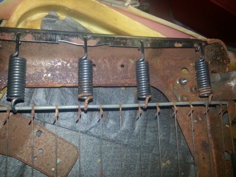 1994 Ford Bronco - The internal springs and frame of a vehicle seat are visible, showing signs of rust and wear.