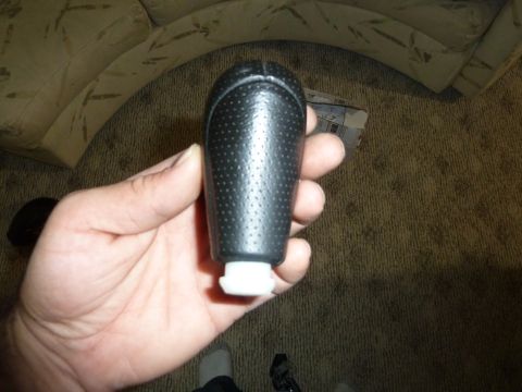 2007 Subaru Impreza - A close-up shot of a gear shift knob being held in a hand.