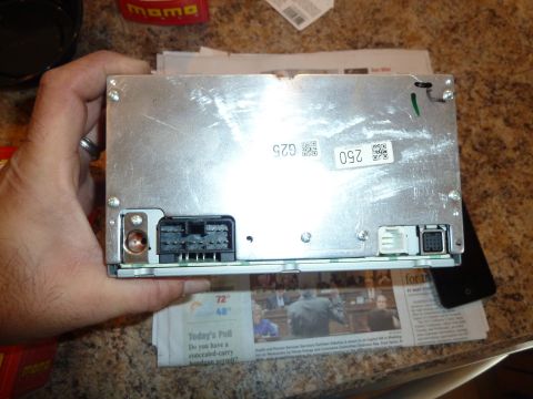 2007 Subaru Impreza - The rear view of a car stereo unit shows various connectors and identifying labels.