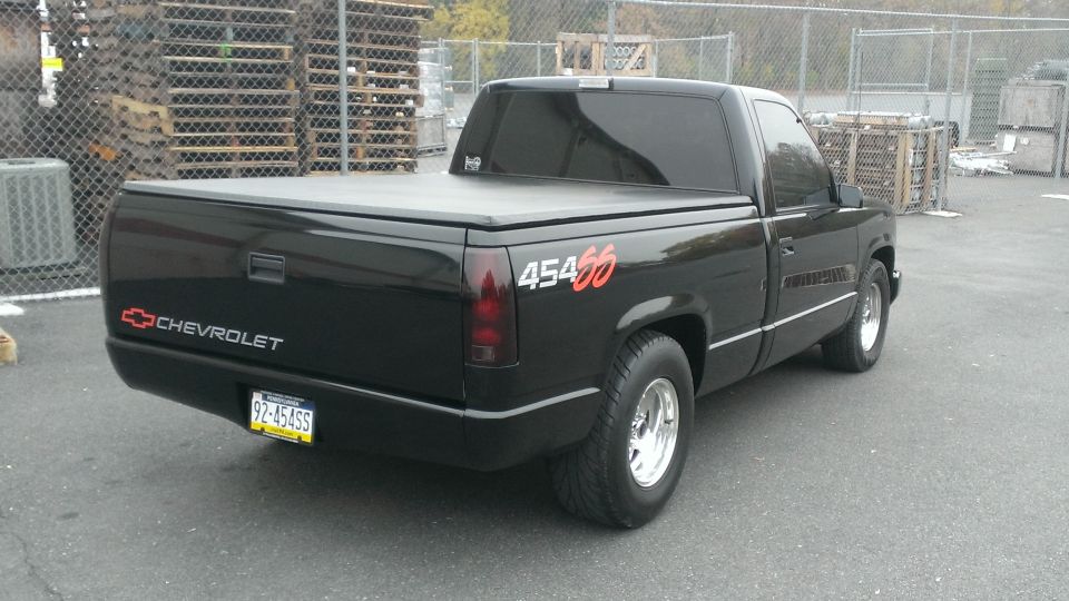 Black 1990 Chevrolet Silverado 1500 rear 3/4 view with "454 SS" badging