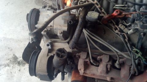 1988 Ford Bronco - Close-up view of an engine, likely from a truck or SUV, showing various components and wiring.