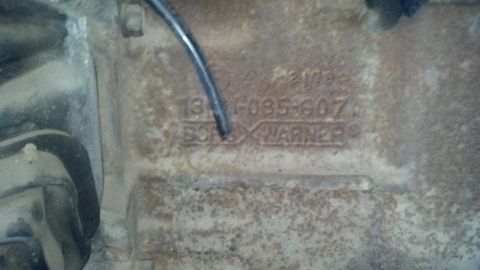 1988 Ford Bronco - A close-up view of a Borg Warner transmission tag, showing a part number and manufacturer name.