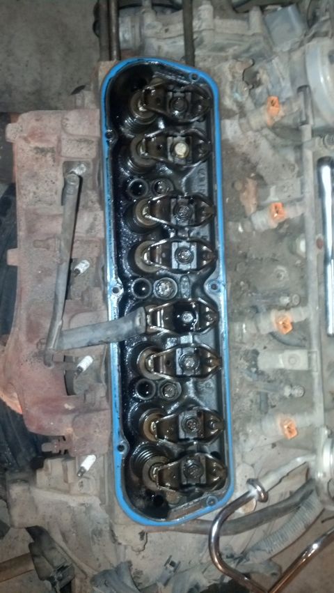 1988 Ford Bronco - Close-up view of an engine's valve cover removed to expose the internal valve train components.