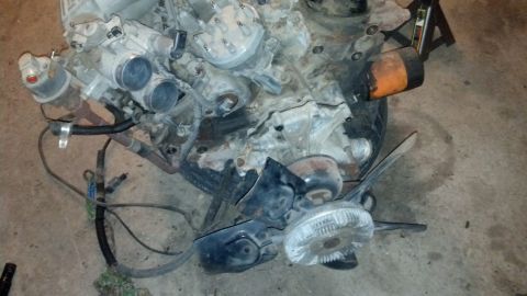 1988 Ford Bronco - This is a V8 engine, likely removed from a vehicle, with various components visible.