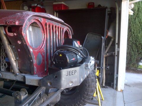 1985 Jeep CJ7 - Custom front bumper with a winch installed on a Jeep CJ-series vehicle.