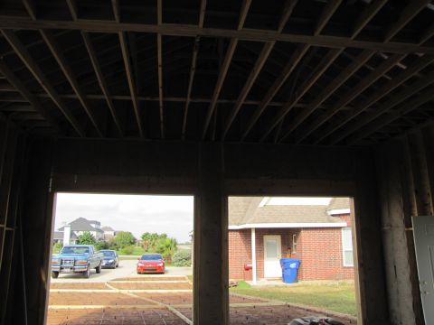 1995 Ford Bronco - View of vehicles from inside a building under construction.