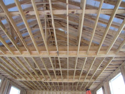 1995 Ford Bronco - Interior view of a building's wooden ceiling structure during construction.