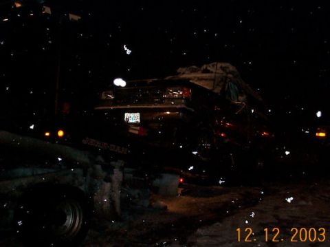 1989 Ford Bronco - A Ford Bronco is parked at night with snow falling. The date 12.12.2003 is visible.