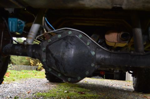 1989 Ford Bronco - Underside view of a vehicle's rear axle, suspension, and exhaust system.