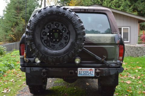 1989 Ford Bronco - This 1989 Ford Bronco features a rear-mounted spare tire and a distinctive camouflage paint scheme.