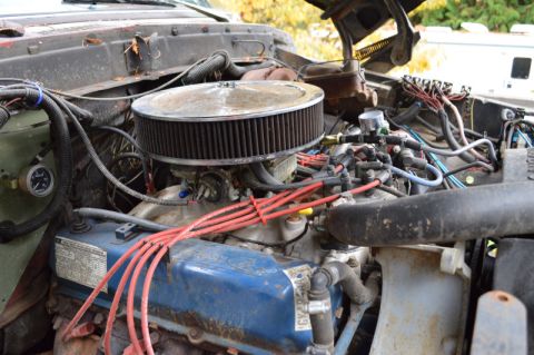 1989 Ford Bronco - Close-up view of the engine bay, showing the air filter, valve covers, and wiring.